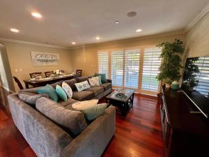 a living room with a couch and a table at Destination #16 in Anaheim