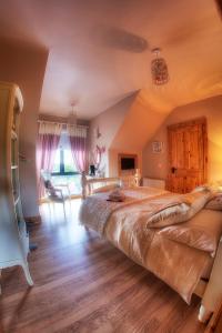 a bedroom with a large bed in a room at Walkers Nest in Carlingford
