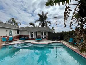 a swimming pool in front of a house at Destination #22 in Anaheim