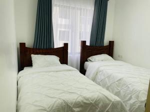 Postel nebo postele na pokoji v ubytování Brooklyn Homes + 6 fotografií