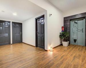 Fotografie z fotogalerie ubytování Townhouse Oak Cochin International Airport v destinaci Nedumbassery + 14 fotografií