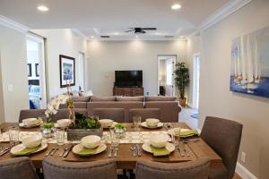 a dining room with a table and a couch at Destination #35 in Anaheim