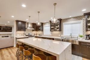 a large kitchen with a large white counter top at Destination #43 in Orange