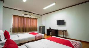 Кровать или кровати в номере OYO 836 PK Residence