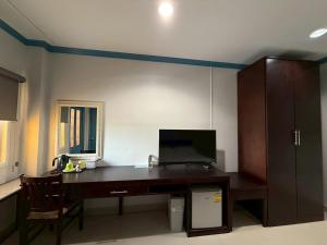 an office with a desk with a computer on it at Garden Hill Hotel in Trang