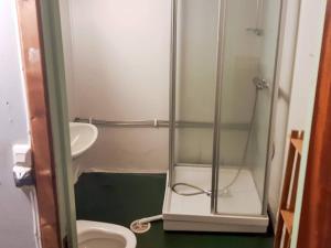 a small bathroom with a shower and a toilet at 8 person holiday home in Åfarnes-By Traum in Årset +28 photos
