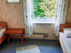 a room with a window and a table and a bed at 8 person holiday home in Åfarnes-By Traum in Årset