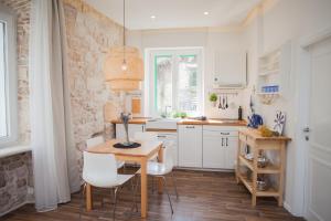 Kuchyň nebo kuchyňský kout v ubytování Apartment Barone