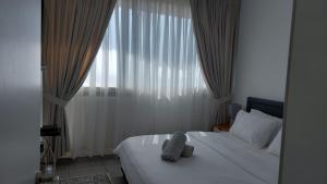 Ένα ή περισσότερα κρεβάτια σε δωμάτιο στο Liz suite +88 φωτογραφίες
