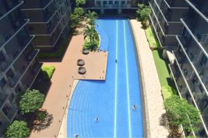 an overhead view of a swimming pool in a building at Callie's Cozy Home at Shore 3 Mall of Asia in Manila