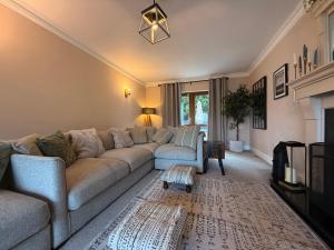 a living room with a couch and a table at Foyleview Point in Balnacart