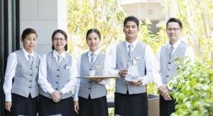 a group of people posing for a picture at Goto Tsubaki Hotel in Goto