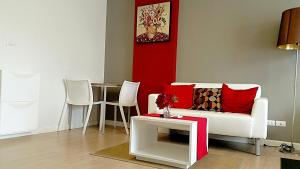 a living room with a couch and a table at ฺBaan Peang Ploen Hua-Hin by Montri.C in Hua Hin