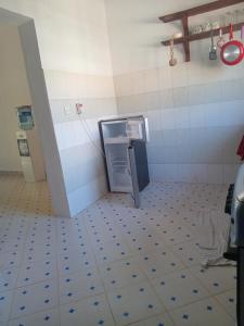 a bathroom with a toilet in a room at Dannys&nickson holiday homes in Watamu