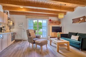 a living room with a couch and a table at Ferienhaus Isolde in Bodenmais