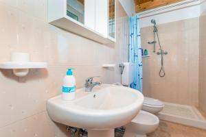 a bathroom with a sink and a toilet at Oasi Dell'Etna in Belpasso