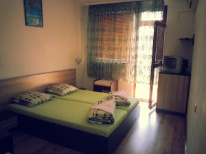 A bed or beds in a room at Villa Diana Self check-in