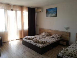 A bed or beds in a room at Villa Diana Self check-in
