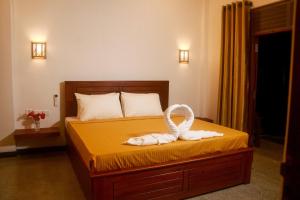 Postel nebo postele na pokoji v ubytování Colours Beach