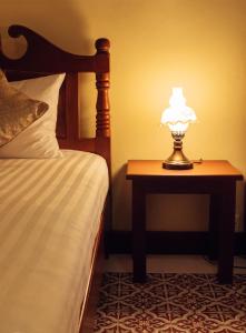 Postel nebo postele na pokoji v ubytování Le Jardin Hotel
