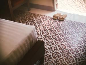 Postel nebo postele na pokoji v ubytování Le Jardin Hotel
