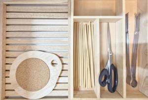 a wooden cabinet with a mirror and some utensils at Aurora Stay in Pongsan-dong +60 photos