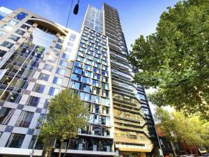 a tall building with a lot of windows at Bright & Modern 2BR Apt Walk to Central in Melbourne