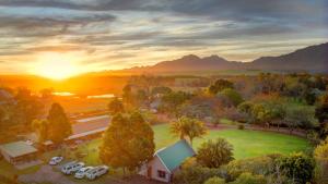 an aerial view of a car dealership with the sun setting at Lentelus Guesthouse Pty Ltd in George