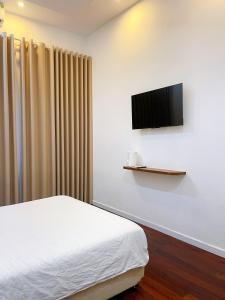 Μια τηλεόραση ή/και κέντρο ψυχαγωγίας στο Ngoc Toan Retreat +4 φωτογραφίες