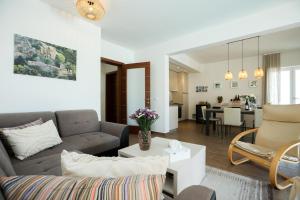 a living room with a couch and a table at Villa Allegra w Private Pool in Škrip