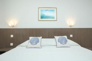 a bedroom with a large bed with two pillows at Villa Allegra w Private Pool in Škrip +48 photos