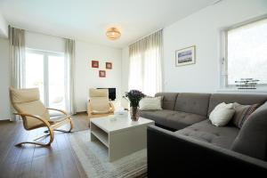 a living room with a couch and a table at Villa Allegra w Private Pool in Škrip