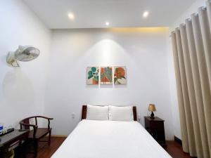 Ένα ή περισσότερα κρεβάτια σε δωμάτιο στο Ngoc Toan Retreat