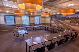 a large room with tables and chairs and a painting at Fletcher Hotel-Restaurant Het Witte Huis in Amersfoort +44 photos