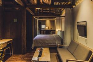 Posezení v ubytování Tsingpu Tulou Retreat