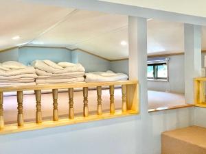 Ένα ή περισσότερα κρεβάτια σε δωμάτιο στο まだらおの湯 +30 φωτογραφίες