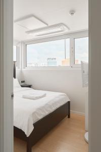 Ένα ή περισσότερα κρεβάτια σε δωμάτιο στο Panoramic View Seoul Station 2BR Newly Built +83 φωτογραφίες