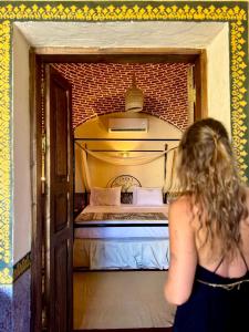 Ένα ή περισσότερα κρεβάτια σε δωμάτιο στο El Juneina Villas