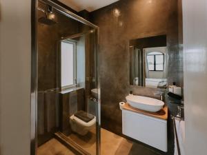 a bathroom with a sink and a toilet at The Place to Stay in Plettenberg Bay +11 photos