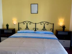 a bedroom with a bed with two lamps on it at San Lorenzo beach in Marina di San Lorenzo