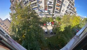 an overhead view of a parking lot with trees and buildings at Podgorica 23 in Podgorica
