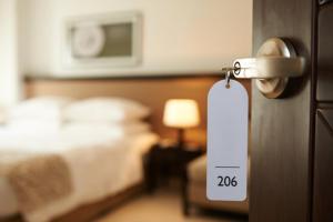 a hotel room with a door knob with a bed at The Granary Apartments in Copenhagen