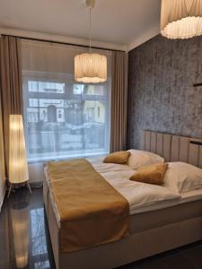 Postel nebo postele na pokoji v ubytování Schwarzwald City Loft 2