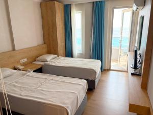Katil atau katil-katil dalam bilik di Azak Beach Hotel +20 gambar
