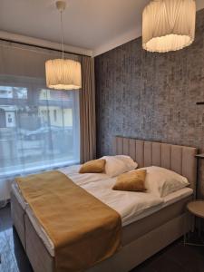 Postel nebo postele na pokoji v ubytování Schwarzwald City Loft 2