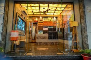 a display window of a store in a building at Hotel Krishna Kashi Diaries in Jāmb