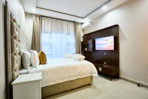 En eller flere senge i et værelse på The Mendel Boutique Residence + 19 billeder