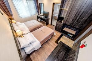 Postel nebo postele na pokoji v ubytování Seawater Spa Hotel Coza