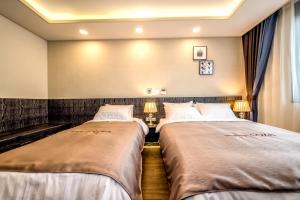 Postel nebo postele na pokoji v ubytování Seawater Spa Hotel Coza