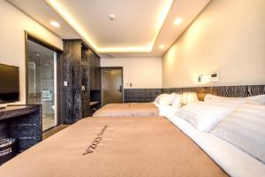 Postel nebo postele na pokoji v ubytování Seawater Spa Hotel Coza
